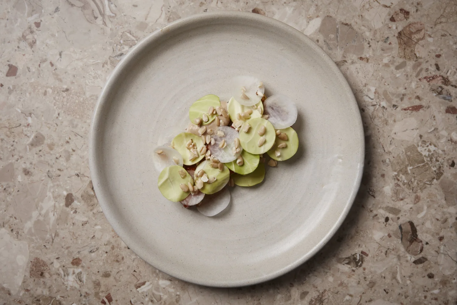 Oyster with apple consommé. Compressed apple, white asparagus, with sorrel beans.