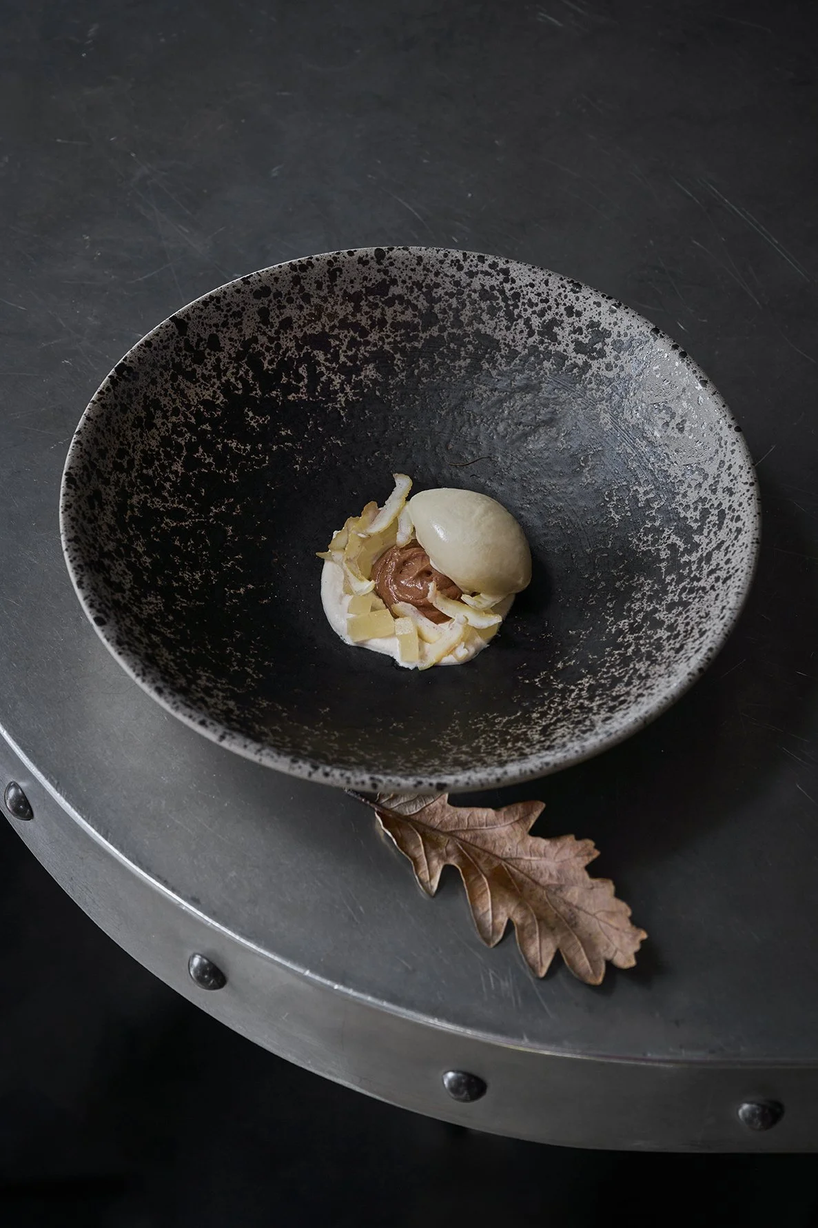 Oyster with apple consommé. Compressed apple, white asparagus, with sorrel beans.
